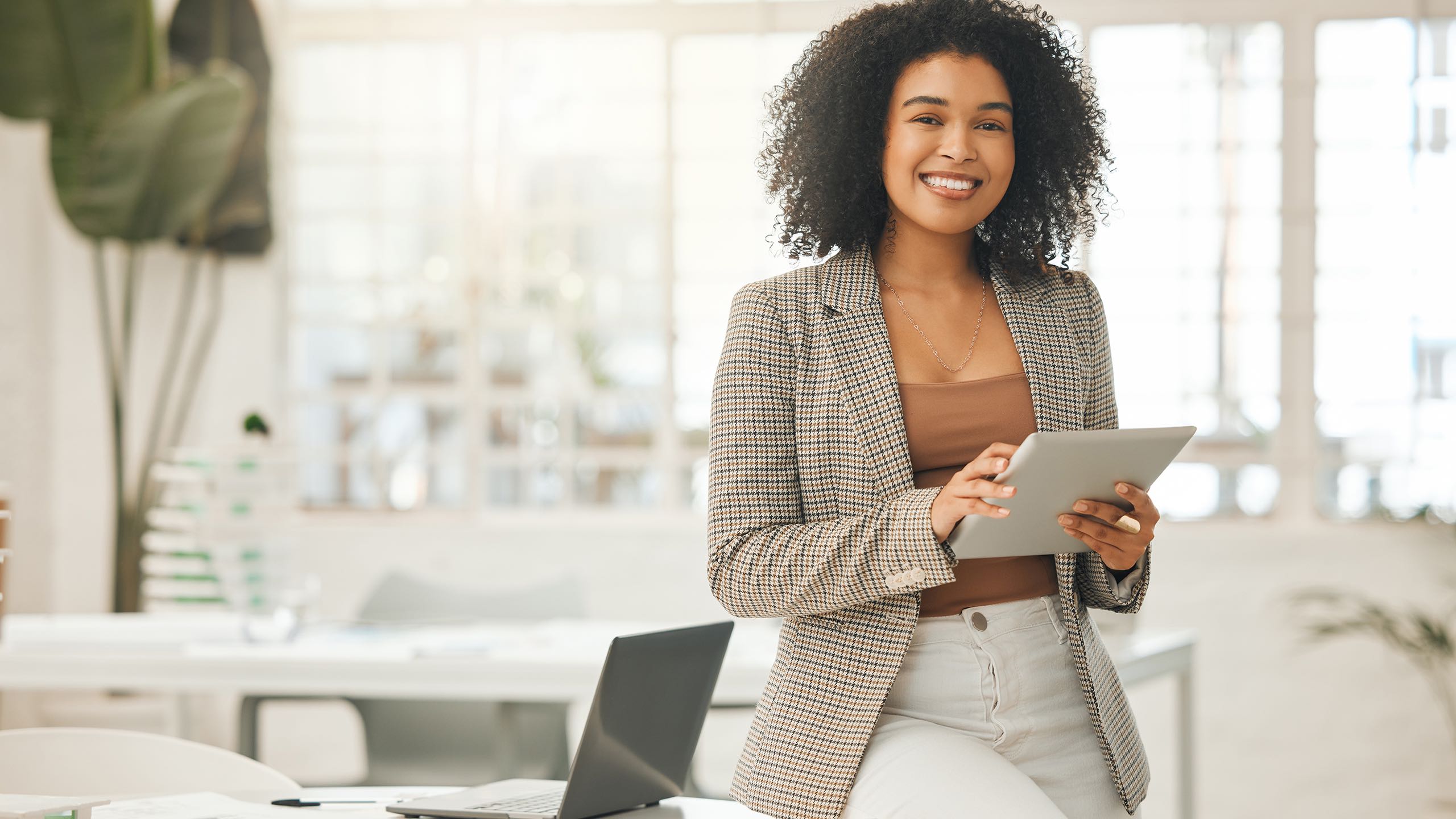 Business woman on iPad in office