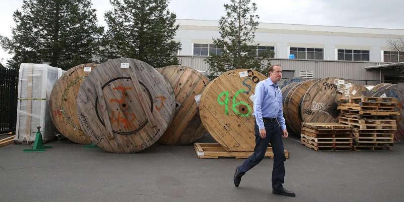 Dane Jasper standing next to fiber cable